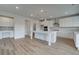 Modern kitchen with white cabinets, an island, stainless steel appliances, and hard surface countertops at 119 Felicity Pike, Locust Grove, GA 30248