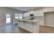 Beautiful kitchen with white cabinetry, stainless appliances and an island with granite countertops at 119 Felicity Pike, Locust Grove, GA 30248