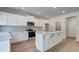 Bright kitchen featuring white cabinetry, stainless appliances and beautiful granite countertops at 119 Felicity Pike, Locust Grove, GA 30248