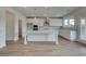 Bright, open kitchen with white cabinets, an island, and stainless steel appliances at 119 Felicity Pike, Locust Grove, GA 30248