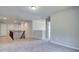 Upstairs landing with neutral carpet and access to various rooms at 119 Felicity Pike, Locust Grove, GA 30248