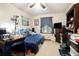 Bedroom with a blue accent wall and natural light at 1292 Marcelle Heights Nw Pl, Norcross, GA 30093