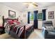 Bright bedroom with a large bed, windows, and comfy chair at 1292 Marcelle Heights Nw Pl, Norcross, GA 30093