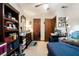 Functional bedroom with a ceiling fan, natural light, and ample storage, great for relaxing and keeping organized at 1292 Marcelle Heights Nw Pl, Norcross, GA 30093