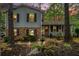 Charming two-story home with a brick and gray exterior, complemented by a welcoming front porch at 1292 Marcelle Heights Nw Pl, Norcross, GA 30093