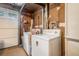 This laundry area boasts a washer, dryer, and convenient access to the garage at 1292 Marcelle Heights Nw Pl, Norcross, GA 30093