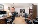 Spacious office area with a desk, chair, and view into an adjoining living space at 1292 Marcelle Heights Nw Pl, Norcross, GA 30093