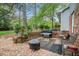Inviting brick patio with outdoor furniture and a built-in brick planter along the house at 1292 Marcelle Heights Nw Pl, Norcross, GA 30093