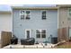 Backyard features a small patio and view of the home's exterior at 1868 Fabian Way, Austell, GA 30106