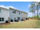Large backyard with a patio, and mature trees at 1868 Fabian Way, Austell, GA 30106