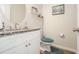 Stylish bathroom with granite countertop, round mirror and nautical decor at 1868 Fabian Way, Austell, GA 30106