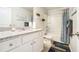 Clean bathroom with granite countertop vanity and shower-tub combo at 1868 Fabian Way, Austell, GA 30106