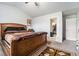 Spacious bedroom featuring a large bed, walk-in closet, and neutral carpet at 1868 Fabian Way, Austell, GA 30106