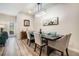 Elegant dining room with contemporary lighting, stylish decor, and seating for four, perfect for intimate dinners at 1868 Fabian Way, Austell, GA 30106