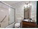 Bathroom with wallpaper, a tub, a toilet, and a vanity at 2340 Castleridge Ct, Tucker, GA 30084