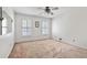 Bedroom featuring neutral walls, shuttered windows, and a ceiling fan at 2340 Castleridge Ct, Tucker, GA 30084