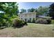 Charming two-story house with a manicured front lawn, mature trees, and traditional architecture at 2340 Castleridge Ct, Tucker, GA 30084