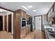 Spacious kitchen with stainless steel appliances, granite countertops, and warm wood cabinets at 2340 Castleridge Ct, Tucker, GA 30084