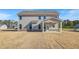 Backyard features a covered patio and ample green space at 115 Felicity Pike, Locust Grove, GA 30248