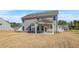 Spacious backyard featuring a covered patio and expansive lawn at 115 Felicity Pike, Locust Grove, GA 30248