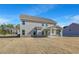 Spacious backyard with covered patio perfect for entertaining and relaxation at 115 Felicity Pike, Locust Grove, GA 30248