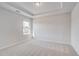Light bedroom with a tray ceiling, carpet, and natural light at 115 Felicity Pike, Locust Grove, GA 30248
