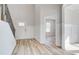 Inviting entryway with paneled walls, hardwood floors, and staircase at 115 Felicity Pike, Locust Grove, GA 30248