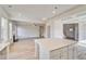 Open living space with luxury vinyl flooring, fireplace, modern ceiling fan, and plenty of natural light at 115 Felicity Pike, Locust Grove, GA 30248