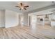 Bright, open-concept living room flowing into the kitchen and entryway at 115 Felicity Pike, Locust Grove, GA 30248