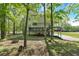 The spacious backyard features mature trees, a tiered deck, and room for recreation at 27 Friendship Rd, Euharlee, GA 30145