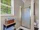 Bathroom featuring a glass door shower, window, and neutral wall colors at 27 Friendship Rd, Euharlee, GA 30145