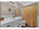 Bathroom with vanity, toilet, and shower with patterned curtain at 27 Friendship Rd, Euharlee, GA 30145