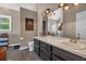 Modern bathroom with double vanity, sleek fixtures, and ample lighting above at 27 Friendship Rd, Euharlee, GA 30145