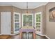 Bright dining area with large windows and a table set for a cozy meal at 27 Friendship Rd, Euharlee, GA 30145