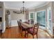 Cozy dining area boasting a wood table, wainscoting, and natural light from bay windows at 27 Friendship Rd, Euharlee, GA 30145