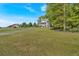 Two story house with a covered porch and large green lawn in a wooded location at 27 Friendship Rd, Euharlee, GA 30145