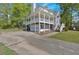 Two story house with a covered porch over a two car garage on a big lot at 27 Friendship Rd, Euharlee, GA 30145