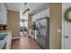 Kitchen area featuring stainless appliances, laminate wood flooring and white cabinetry at 27 Friendship Rd, Euharlee, GA 30145