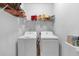 Laundry room featuring a side-by-side washer and dryer and storage shelves at 27 Friendship Rd, Euharlee, GA 30145
