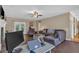 Comfortable living room with a ceiling fan, laminate floors, fireplace and lots of natural light at 27 Friendship Rd, Euharlee, GA 30145