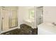 Bathroom featuring a shower, soaking tub, and white vanity at 3239 Rose Petal Ln, Powder Springs, GA 30127