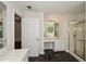Bathroom featuring dual vanities, marble floors, and separate shower and tub at 3239 Rose Petal Ln, Powder Springs, GA 30127