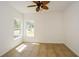 Bedroom featuring tile floors, two windows, and a ceiling fan at 3239 Rose Petal Ln, Powder Springs, GA 30127