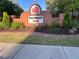 Rosewood Park brick community entrance sign with manicured landscaping at 3239 Rose Petal Ln, Powder Springs, GA 30127