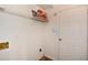 Bright laundry room with shelving and white painted walls, providing practical storage at 3239 Rose Petal Ln, Powder Springs, GA 30127