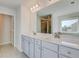 Bright bathroom featuring a double vanity, large mirror, and tile flooring for a clean and modern look at 123 Felicity Pike, Locust Grove, GA 30248