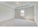 Spacious bedroom with plush carpet, neutral walls, and a large window with outside view at 123 Felicity Pike, Locust Grove, GA 30248