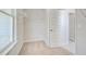 Carpeted closet with wire shelving, door and a window to the exterior at 123 Felicity Pike, Locust Grove, GA 30248