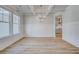 Bright dining room with wood-look floors, a coffered ceiling, and stylish wainscoting at 123 Felicity Pike, Locust Grove, GA 30248