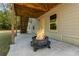 Cozy back patio featuring a fire pit and staircase at 19 Four Feathers Ne Ln, Rydal, GA 30171